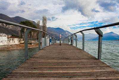 Pier over sea against sky