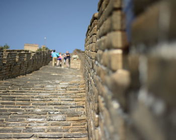 Tourist on great wall of china against sky