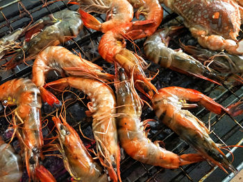 Shrimp on fire, closeup grilled shrimp on fire, shrimp crab on fire, hot grill, shrimp crab menu