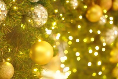 Close-up of illuminated christmas tree at night