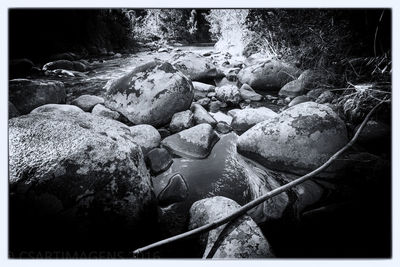 Close-up of pebbles in water