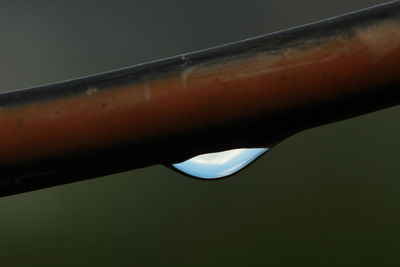 Close-up of metal against sky