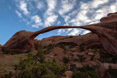 View of rock formations against cloudy sky