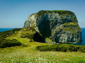 Scenic view of rocks against clear sky