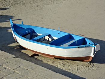 High angle view of boat moored on beach