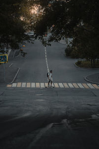 Rear view of man walking on street