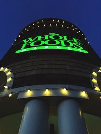Low angle view of illuminated lights at night