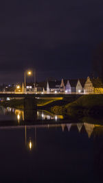 Illuminated buildings in city at night