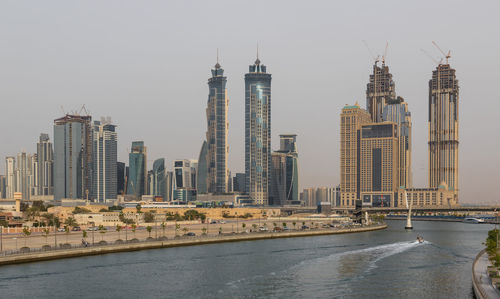 Modern buildings in city against sky