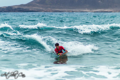 Man surfing in sea