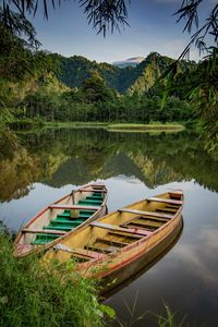 Two boat in the lake with mount background