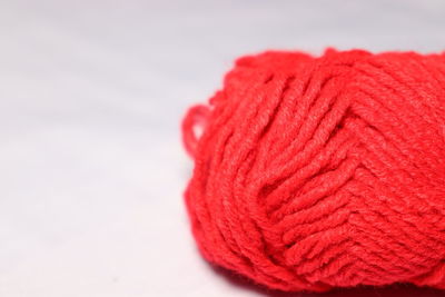 Close-up of red leaf against white background