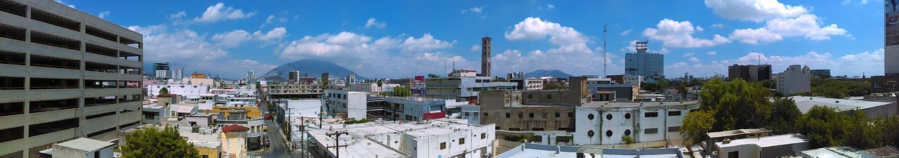 Panoramic view of cityscape against sky