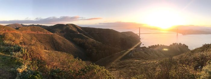 Panoramic view of mountains against sky during sunset