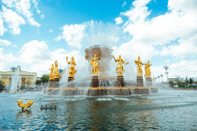 Statue of fountain against cloudy sky