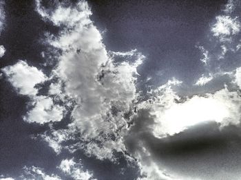 Close-up low angle view of snow against sky