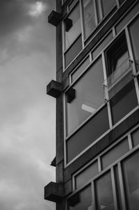 Low angle view of building against cloudy sky