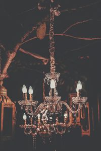 Close-up of illuminated lanterns hanging at night