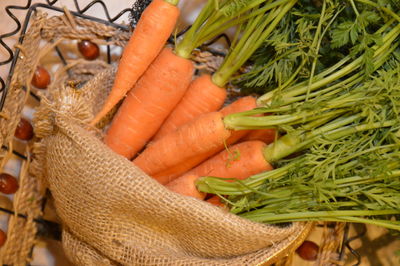 Close-up of carrots in sack