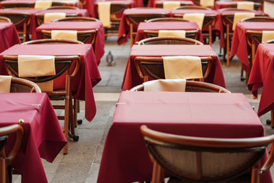 Empty chairs and tables at cafe