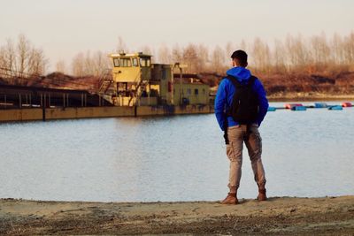 Rear view of man standing on beach