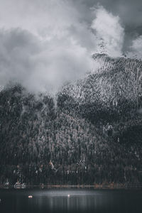 Overcast mountains above a lake.