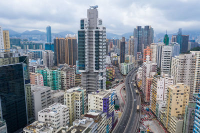 High angle view of modern buildings in city against sky