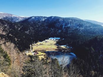 Scenic view of mountains against blue sky