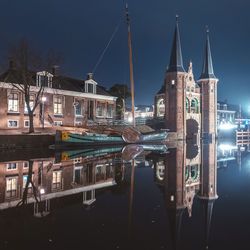 Reflection of illuminated buildings in water at night