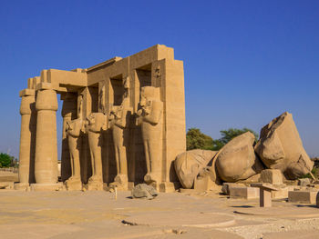 Statue of historic building against clear sky