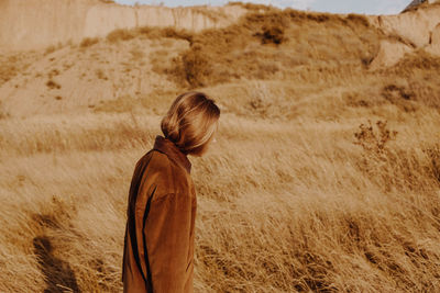 Side view of woman standing on land