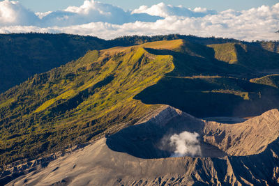 Scenic view of volcanic mountain range against sky