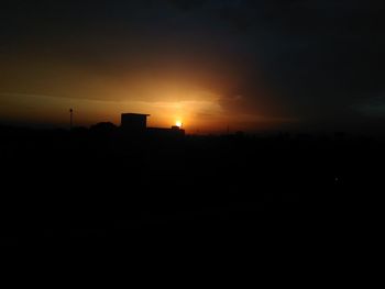 Silhouette landscape against sky during sunset