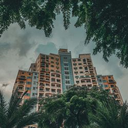 Low angle view of apartment buildings against sky
