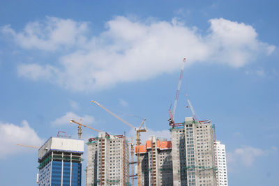 Modern buildings against sky in city