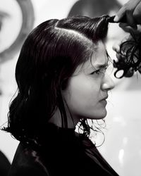 Portrait of a young woman looking away