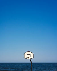 View of sea against clear blue sky