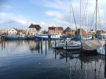 Boats moored at harbor