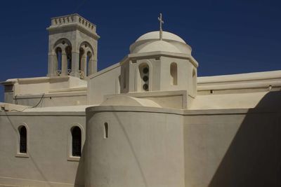 Low angle view of building against clear blue sky