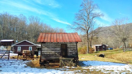 Barn against sky during winter