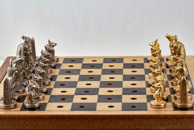 Close-up of chess pieces on table