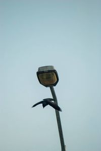 Low angle view of windmill against clear sky