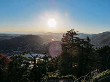 View of trees on mountain against sky