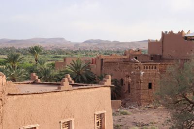 Houses and buildings against sky