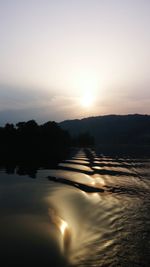 Scenic view of silhouette landscape against sky during sunset