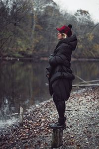 Full length of man standing in forest