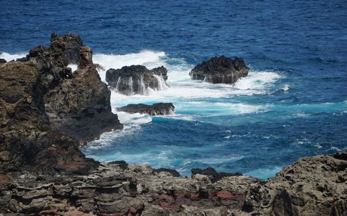 Scenic view of rocks in sea