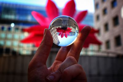 Close-up of person holding glassball