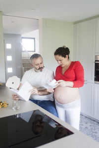 Man and woman sitting on table