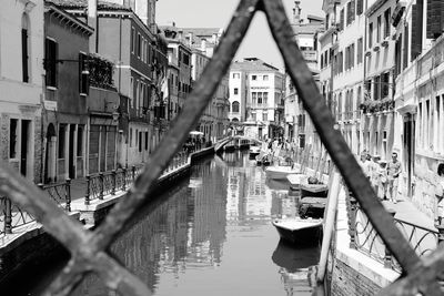 Canal amidst buildings in city